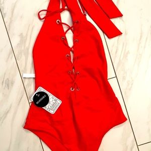 Sexy red one piece with tags and brand new!
